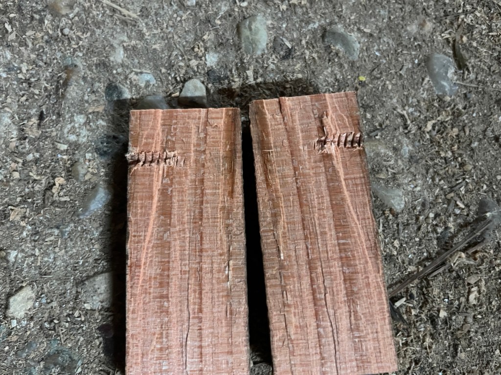 How the inside of the split wood looks. You can see the screw marks on either side, like a fossil that’s been cracked in half 