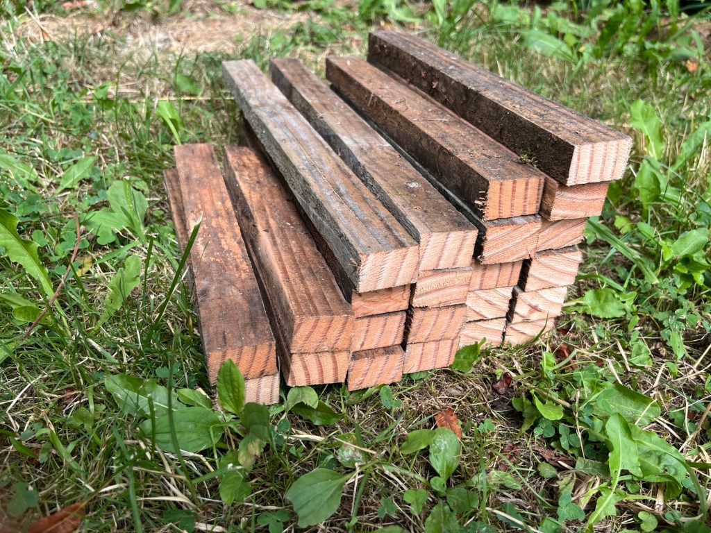 All the pieces together on the grass. Three piles of each length needed. 